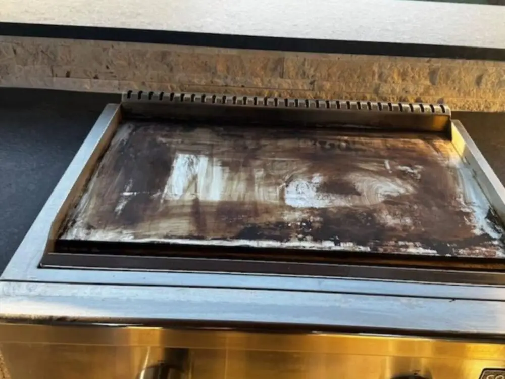 Built-in flattop griddle before cleaning
